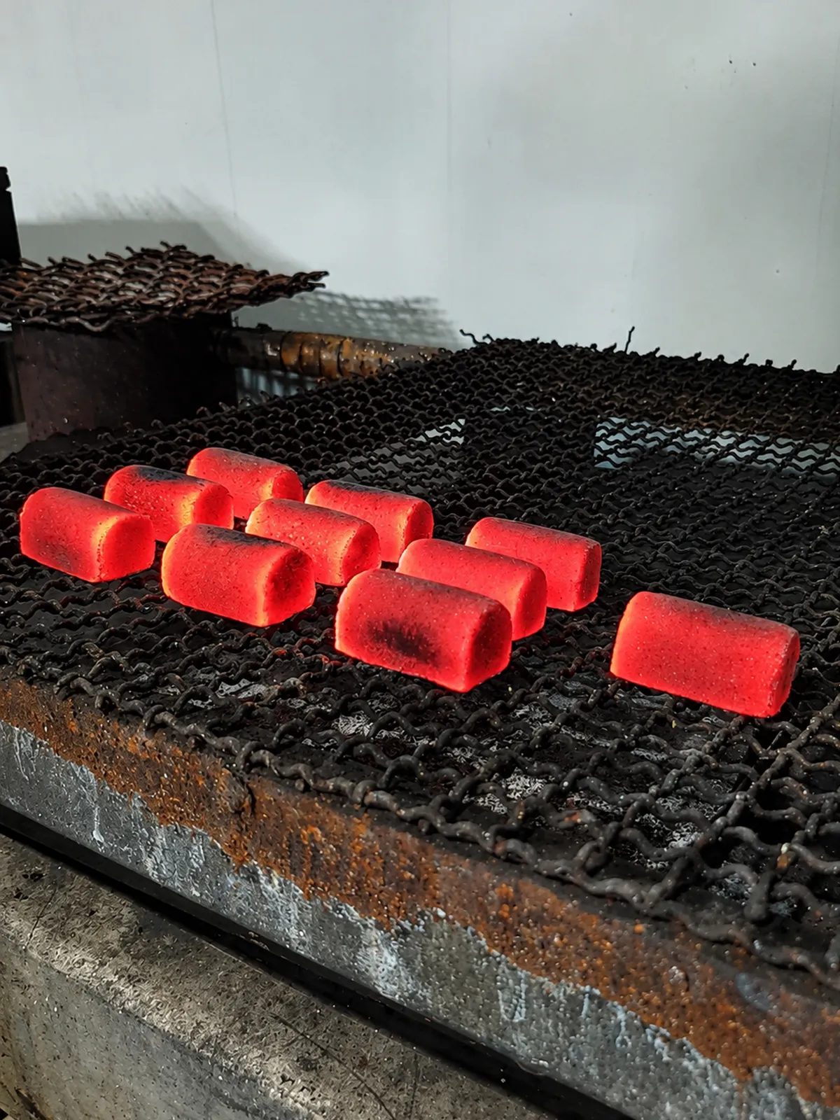 Burning half cylinder coconut charcoal briquettes for hookah
