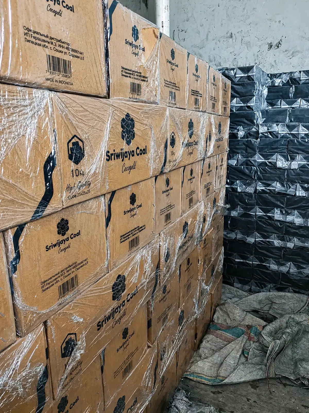 Stacked master boxes of coconut charcoal briquettes ready for export